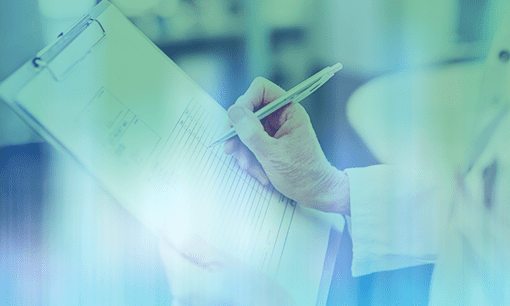 inspector in lab coat writes on clipboard for lab audit